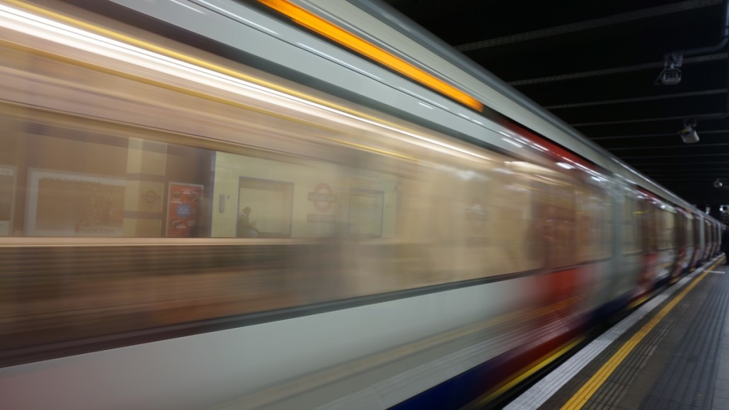 blurred-motion-of-train-at-railroad-station lr